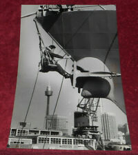 1982 Press Photo Crew Member Paints USS Goldsborough Stern From Harness Sydney picture