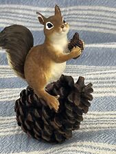 Resin Squirrel Standing On Pinecone And Holding Pinecone picture