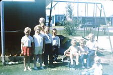 35MM Found Photo Slide 1963 Group of Children Swing Set Red Wagon Gunsmoke Shirt picture