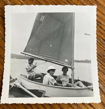 Three Teenage Girls Lounging on a Sailboat on the Water 3