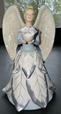 Avon 2006 Winter Angel Holding Flowers Porcelain Figurine 6” Tall Beautiful picture