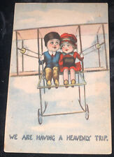 C1910  Antique Art COMIC POSTCARD BOY AND GIRL IN BI-PLANE HAVING HEAVENLY TRIP picture
