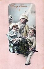 A Merry Xmas, Kids Getting Ready Christmas. Used Vintage Postcard picture