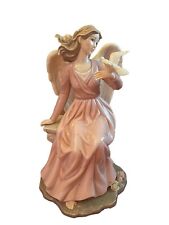 Grandeur Noel Porcelain Angel Sitting In Pedestal Holding Dove Pink & White picture