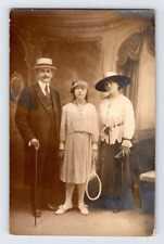 RPPC 1920'S. YOUNG TENNIS PLAYER W/ PARENTS. POSTCARD WA17 picture