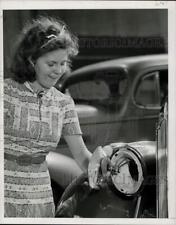 1939 Press Photo Miss Mulvihill displays an automobile headlamp - nef73502 picture
