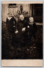 RPPC Postcard~ Two Young Boys With Big Bows Pictured With Their Grandmother picture