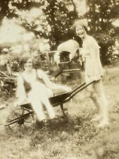 (AmJ) FOUND Photo Photograph Vintage Glowing Girls Wheelbarrow Exposure Odd picture