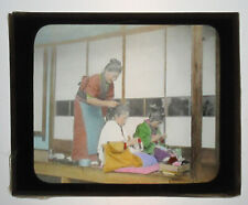 JAPANESE MOTHER TENDING TO DAUGHTERS HAIR. HAND COLORED PHOTO ON GLASS.  picture