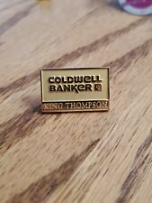 Gold tone Coldwell Banker King Thompson logo badge realtor realty lapel pin qv picture