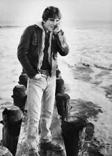 Matt Dillon poses on wooden barriers at the beach USA 1980 Old Photo picture