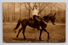 RPPC Young Man Riding A Horse Through Wooded Park Real Photo Postcard picture