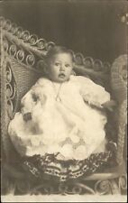 RPPC Beautiful baby Edwardian fashion locket curled wicker chair real photo PC picture