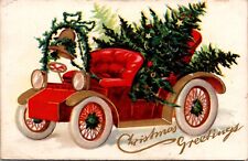Christmas Postcard Red Open Air Automobile Filled with Pine Trees Gold Bell picture