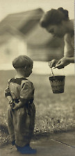 Child With Hands Behind Back Looking At Toy Pail B&W Photograph 2.75 x 6 picture