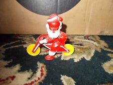 Vintage ROSBRO Santa Claus On Bicycle Christmas Candy Container Toy Plastic picture