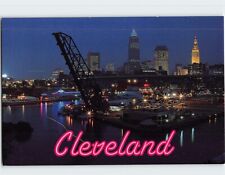 Postcard Bright city lights illuminate the nighttime skyline Cleveland Ohio USA picture
