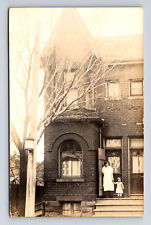 RPPC Mother & Small Girl on Porch of Large Brick Two Story Urban Home Postcard picture