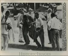 1960 Press Photo Congo's Albert Ndele aided by 2 Europeans after being beaten picture