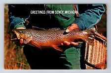 Seney MI-Michigan, Guy Holding A Fish, Greetings, Souvenir, Vintage Postcard picture