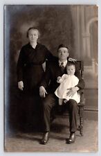 c1910~Family with Baby~Handsome Studio Portrait~Dark~Antique RPPC Postcard picture