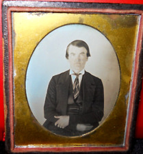 1/6th size Scovills Daguerreotype of young man in half case picture