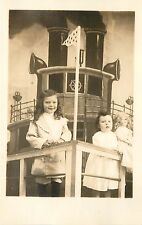 c1915 RPPC Postcard; 2 Little Girls & Doll, Photographer's Cruise Ship Backdrop picture