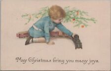 Postcard Christmas Little Boy Playing with Train 1916 picture