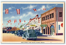 c1940's Red White Decorations Main Street First Block Tijuana Mexico Postcard picture