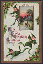 Christmas postcard 1911: Three green-clad elves cavort in spider web picture