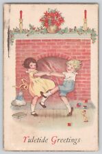 Postcard Christmas Yuletide Greetings Children Dancing By Fireplace Vintage picture