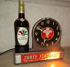 1940'S THREE FEATHERS LIGHTED WHISKEY DISPLAY CLOCK picture