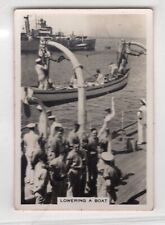 Military Shipping Card. The Royal Navy lowering a galley boat HMS Devonshire picture