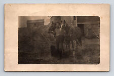 RPPC Young Boy Tends to Two Hoses Rigged for Buggy at Barn Real Photo Postcard picture