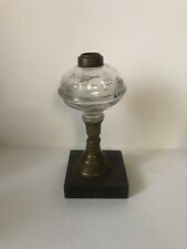 ANTIQUE VICTORIAN  GLASS OIL LAMP ON A BRASS WITH   BASE picture