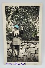 Caption ANOTHER LOOSE NUT~Vtg HAND TINTED Photo~Woman Sitting Rock Wall~May 1922 picture