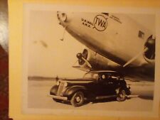 Old photo of a 1937 Studebaker champion 4 door At the airport picture