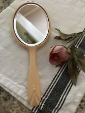 Hand Held Vanity Mirror in Bakelite Soft Peach Color Beveled Mirror picture