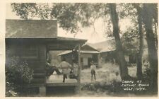 Postcard RPPC -C910 Wyoming Wolf Cabins Eaton Ranch occupation roadside 23-12334 picture