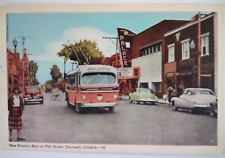 ELECTRIC BUS - CORNWALL, ONTARIO POSTCARD  PALACE THEATER  '39  OLDS '52 CHEVY picture