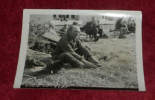 WWII Press Photo Unidentified Soldier Barefoot In Hay Unknown Location picture