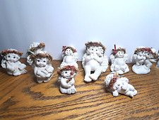 Vintage Dreamsicles Figurines 9 Piece Lot  Praying-Holding Baby-Holding a Rabbit picture