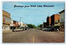c1950s Road and Cars Scene, Greetings from Shell Lake WI Posted Vintage Postcard picture