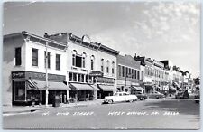 Postcard RPPC West Union IA Vine Street Hardware Rexall Bank Old Cars 1950s P8M picture