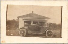 c1910s RPPC Real Photo Postcard Man in Automobile / Street View 