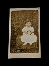 1904-1918 RPPC Photograph Postcard Of Baby Boy Holding Horseshoe picture