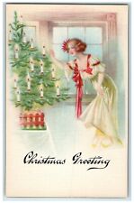 c1910's Christmas Greeting Woman Lighting Candles Unposted Antique Postcard picture