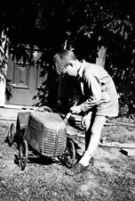 Greensborough, Victoria, 1959 A boy painting a pedal car Old Photo picture