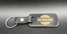 Vintage Nissan Universal Brass Keychain Auburn WA Black  picture