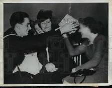 1942 Press Photo US Navy Airman Bill Farnsworth Putting Paper Hat on Woman Head picture